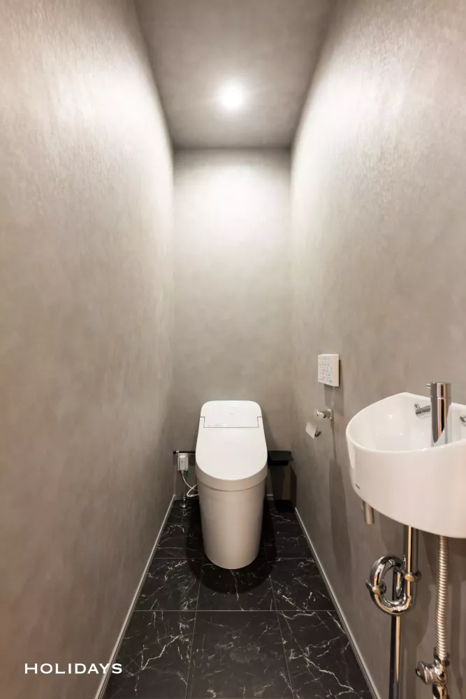 趣味を楽しむインナーガレージのある平屋