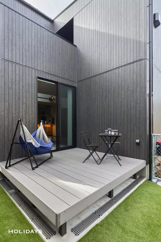 吹き抜けを採用した趣味と暮らすアメリカンテイストの家